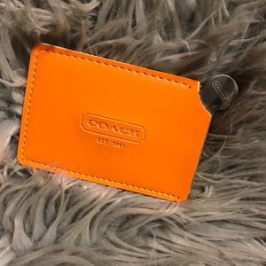 COACH orange pocket mirror